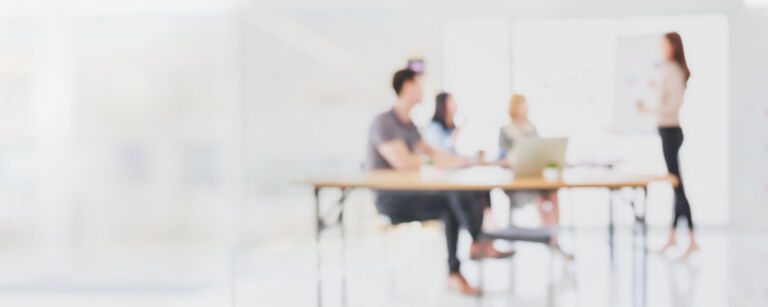 Abstract blurred interior modern office space with business people group working banner background with copy space.