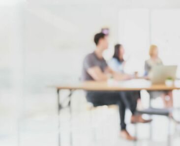 Abstract blurred interior modern office space with business people group working banner background with copy space.